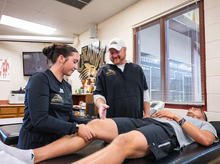 Jason Ensrud works with two NWU students.